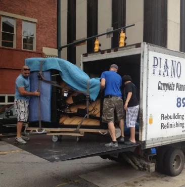 Piano Movers moving a piano