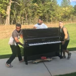 Men Moving a piano